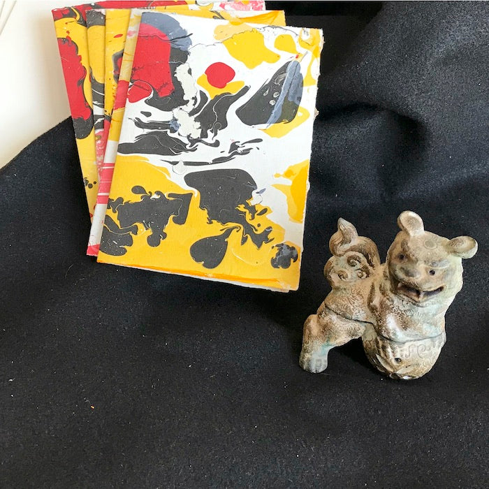 hand made note card, red, yellow, black, yellow, marbled