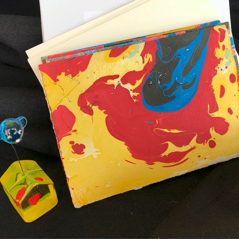 hand-marbled note card, yellow, red, blue, black